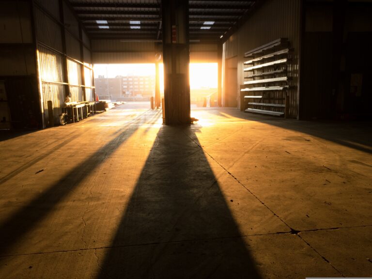 warehouse loading dock with doors open, in full sunshine